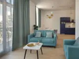 Salon d'un appartement de la résidence senior Domitys à Poissy - Domitys Le Parc des Aubiers Poissy